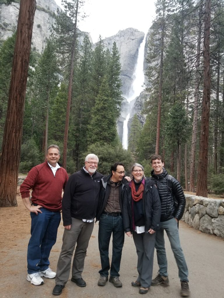 Architects and engineers on site at Yosemite standing on the path leading to Yosemite Falls