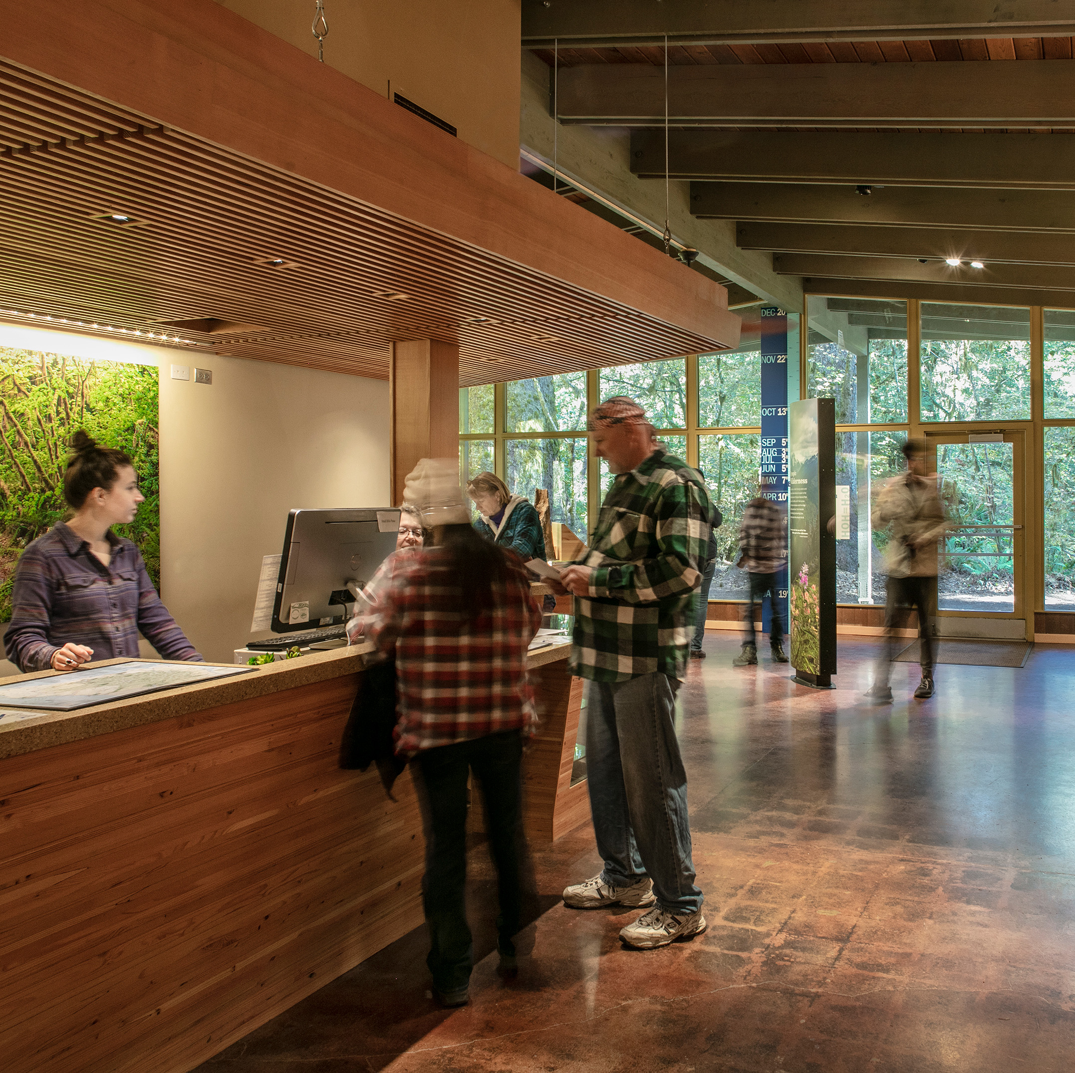 People talking to a ranger at the visitors center in Olympic National Park