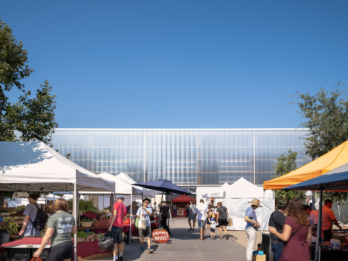 Sunny day with Farmers Market Vendor Stalls in outside courtyard