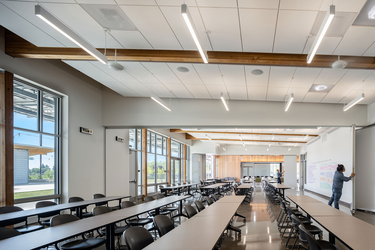 Multiple classrooms combined by opening movable walls to create a larger, single space