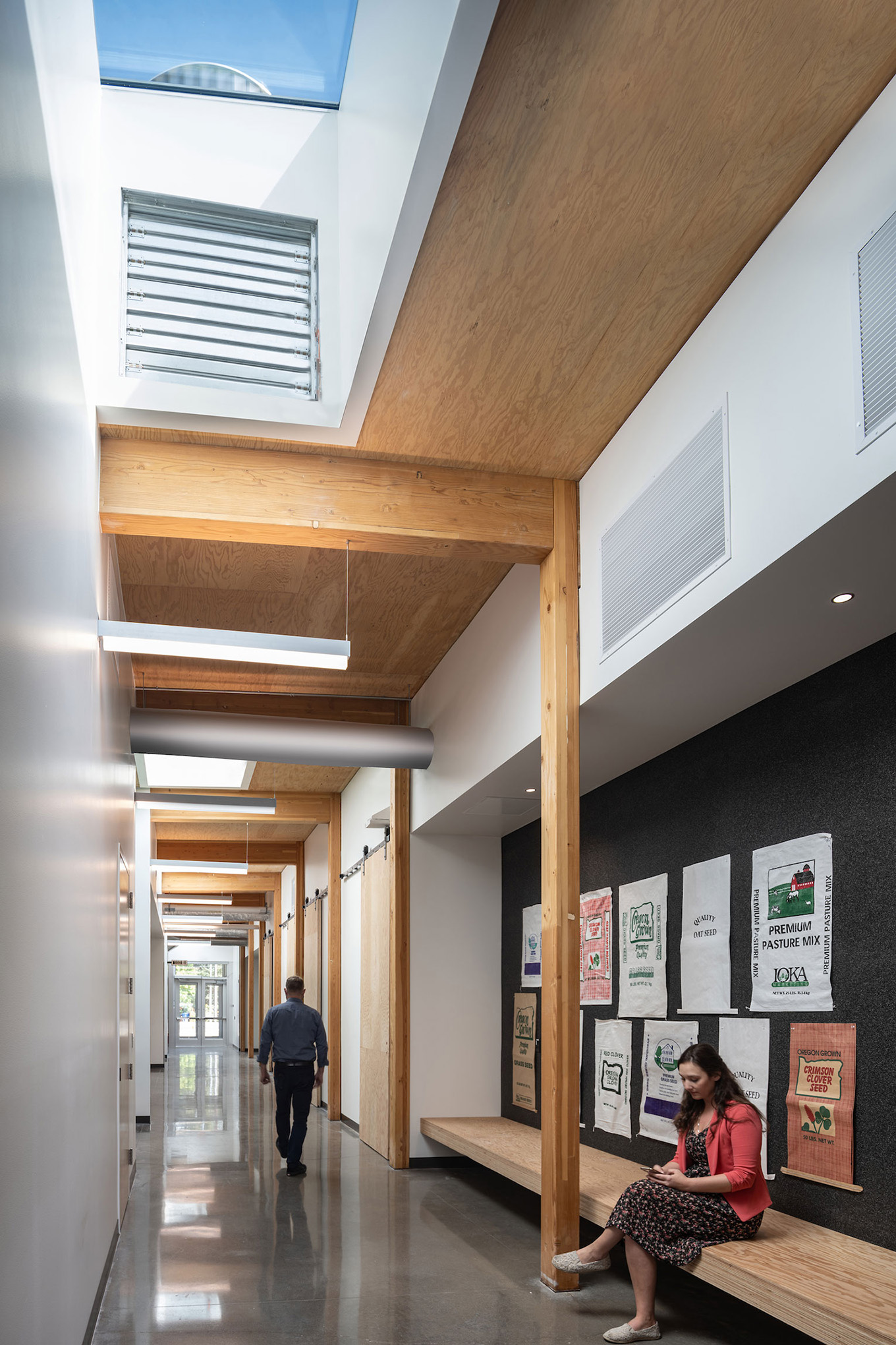 Hallway with skylight and wind turbine illustrating natural lighting and passive ventilation