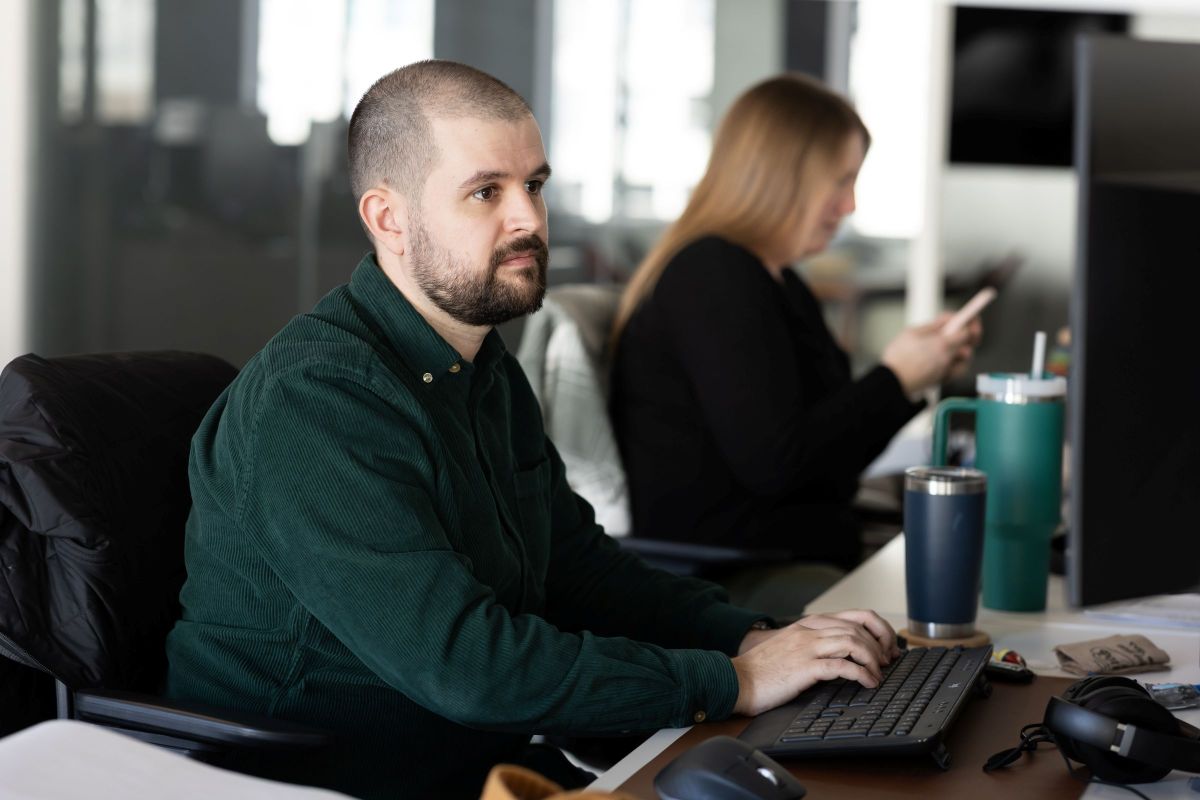FFA team member Davis Carlisle works at a computer in the firm’s open, collaborative architecture studio