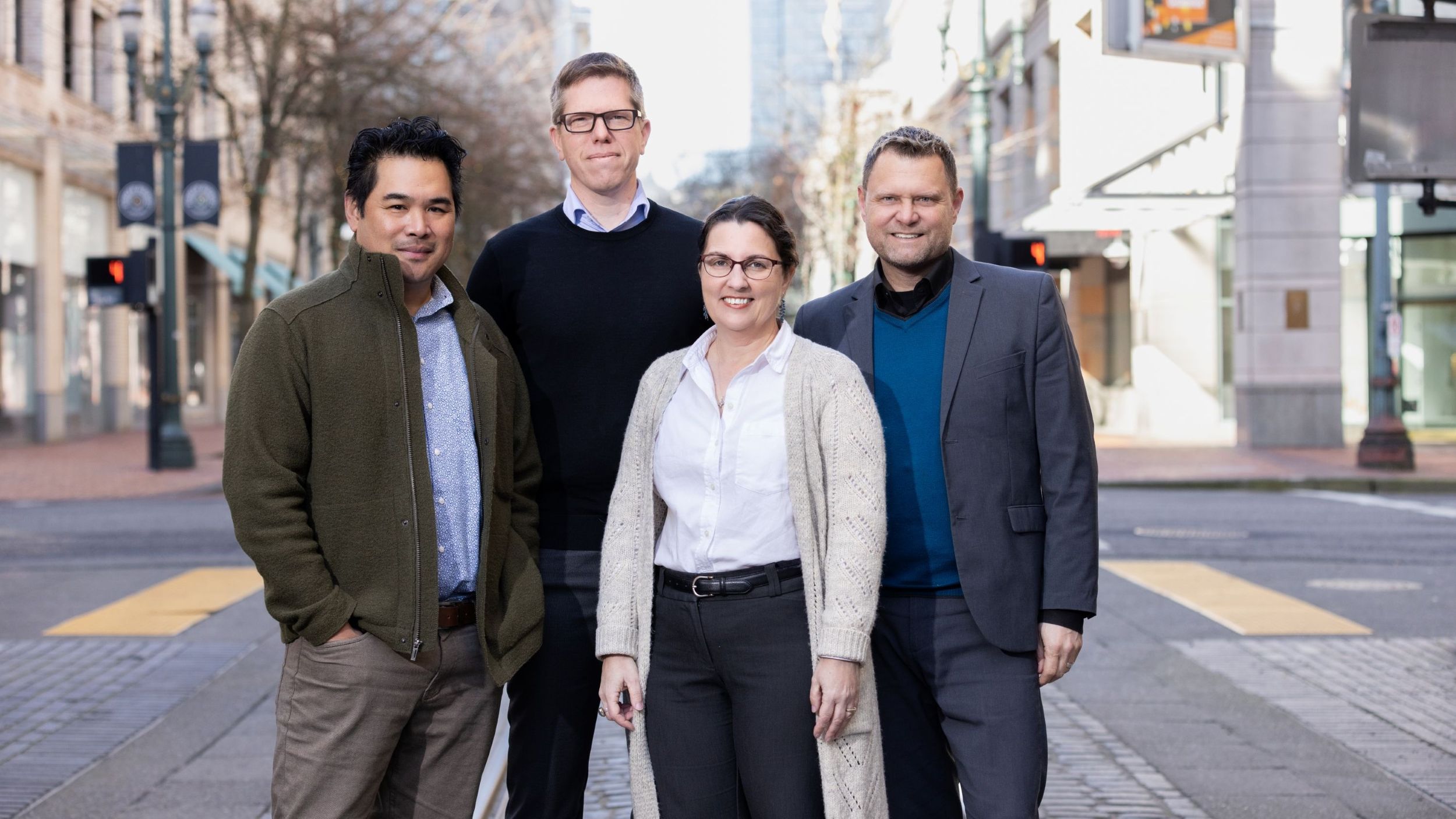 FFA’s four partners stand together on a downtown Portland street, representing the firm’s leadership team