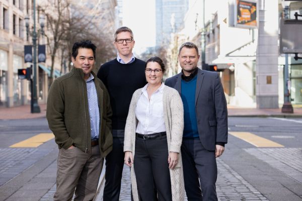FFA’s four partners stand together on a downtown Portland street, representing the firm’s leadership team