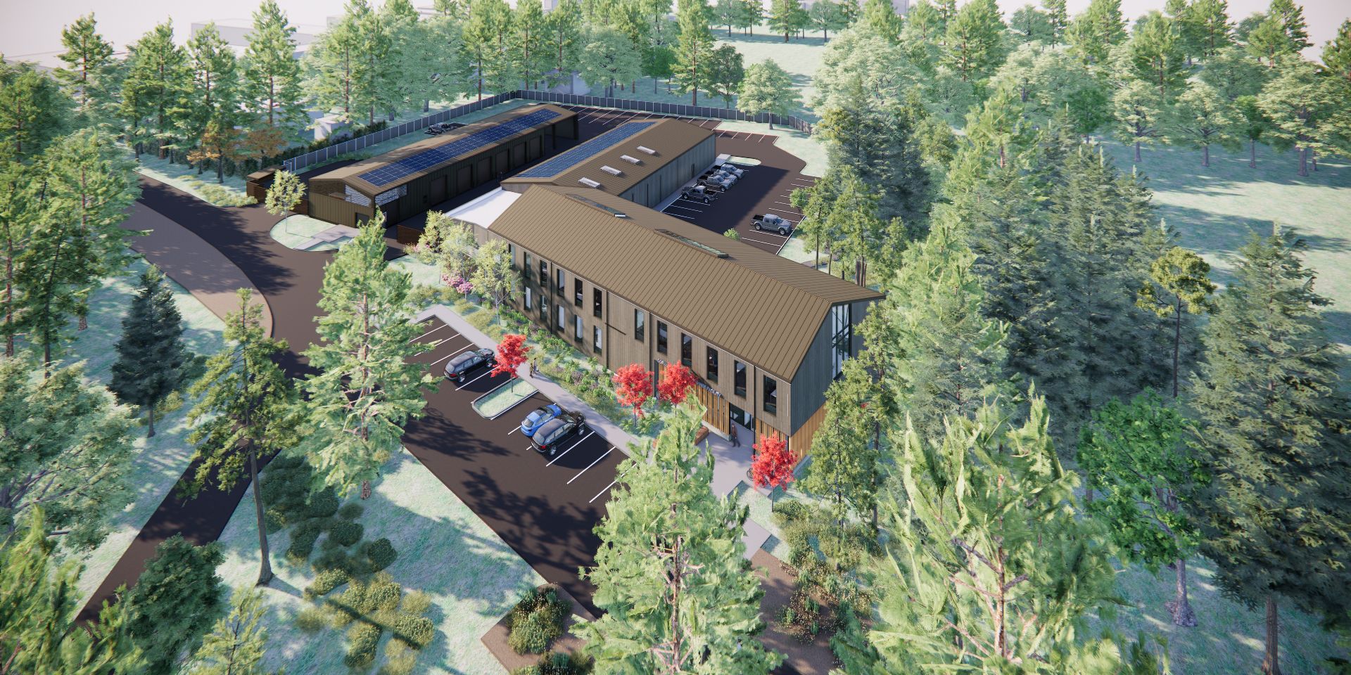 Aerial rendering of the Corvallis Parks Operations Facility shows offices, shops, vehicle storage, solar panels, and parking integrated into a wooded site.