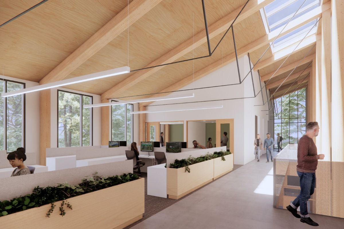 Rendering of the Corvallis Parks Operations Facility open office shows a daylit mass timber workplace with skylights, planted dividers, and views to the surrounding landscape.